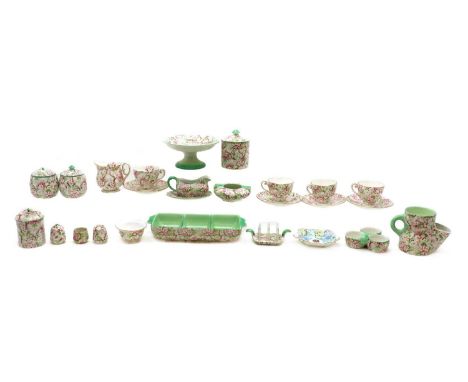 A collection of Shelley porcelain 'Maytime' pattern wares,comprising a cream jug, 9.5cm high, four side plates, 16cm diameter
