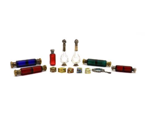 A collection of scent bottles,comprising four double ended examples, the green and ruby bottles with internal stoppers, longe