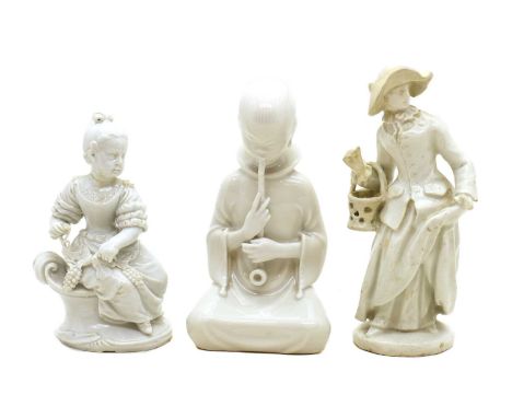 A group of three blanc de chine porcelain figures,comprising an 18th-century figure, of a lady, holding a basket, 15cm high, 