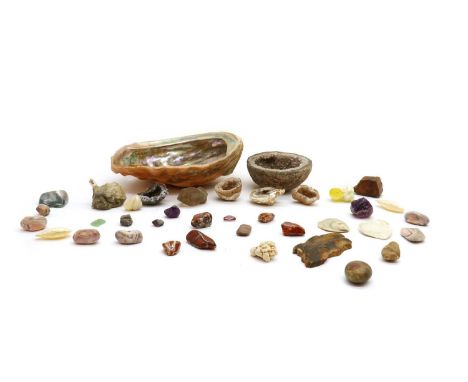 A collection of semi precious stones and shells,to include an abalone shell, an amethyst geode, and petrified wood, contained