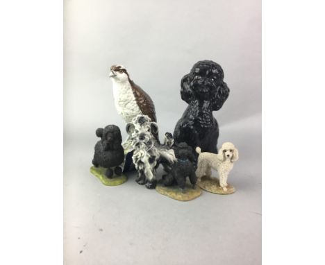 GROUP OF CERAMIC AND RESIN ANIMAL FIGURES, including a Gleneagles osprey decanter, the tallest figure 21cm high