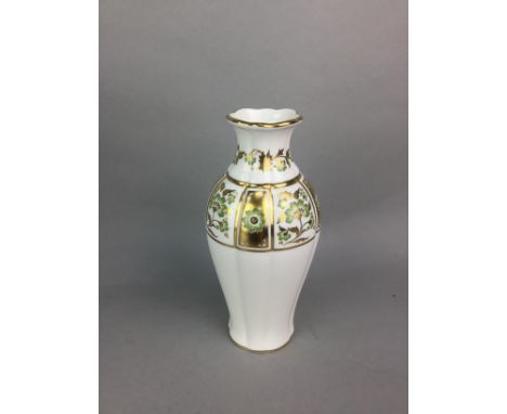 ROYAL CROWN DERBY VASE, 17cm high, along with two Wedgwood vases and a miniature Royal Worcester vase (4)