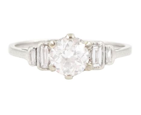 Art Deco platinum diamond ring, principal old cut diamond of approx 0.60 carat, with two graduating baguette cut diamonds set