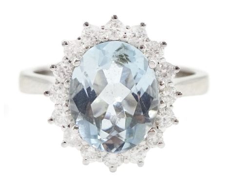 18ct white gold oval cut aquamarine and round brilliant cut diamond cluster ring, hallmarked, aquamarine approx 2.30 carat, t