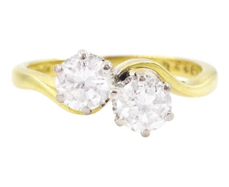 18ct gold two stone round brilliant cut diamond crossover ring, London 1975, total diamond weight approx 1.10 caratCondition 
