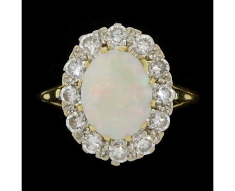 18ct gold opal and round brilliant cut diamond cluster ring, London 1990, total diamond weight approx 0.60 caratCondition Rep