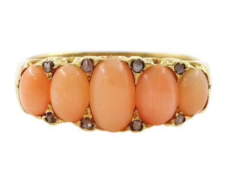 Early 20th century 18ct gold five stone graduating coral ring, with diamond accents set between, stamped 18cCondition Report: