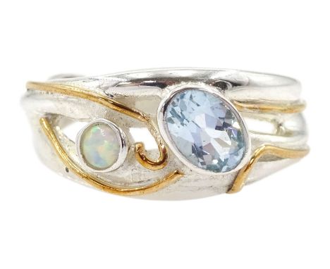 Silver and 14ct gold wire blue topaz and opal ring, stamped 925Condition Report:Size N, good condition