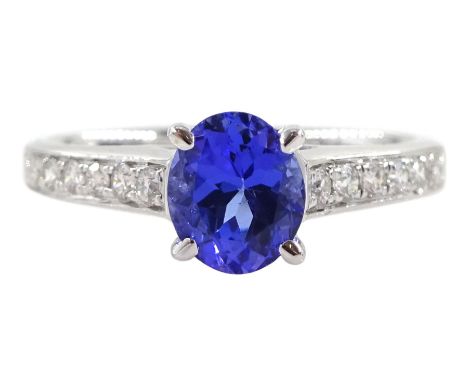18ct white gold oval tanzanite ring, with channel set round brilliant cut diamond shoulders, stamped 750, tanzanite approx 0.