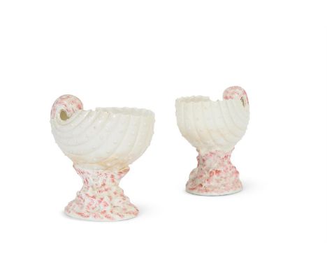 A PAIR OF POTTERY VASES MODELLED AS NAUTILUS SHELLS ENGLISH, THIRD QUARTER 19TH CENTURY Partially decorated in pink, 26cm hig