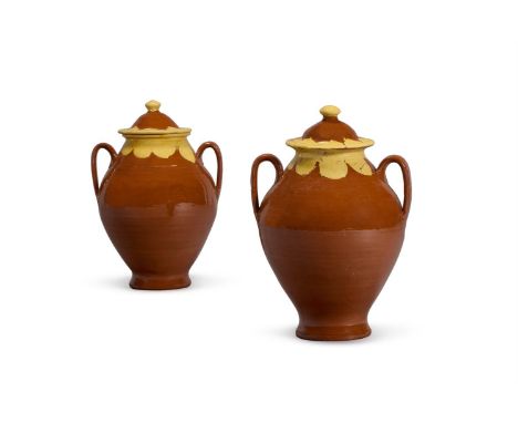 A PAIR OF BROWN-GLAZED POTTERY TWO-HANDLED STORAGE JARS AND COVERS LATE 19TH CENTURY 43.5cm high, 28cm diameter   Condition R