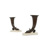 A PAIR OF REGENCY BRONZE RHYTON VASES ON WHITE MARBLE BASES, EARLY 19TH CENTURY