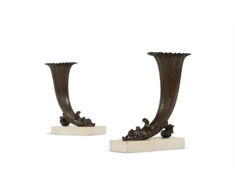A PAIR OF REGENCY BRONZE RHYTON VASES ON WHITE MARBLE BASES EARLY 19TH CENTURY  22.5cm high, 16cm wide, 8cm deep    Condition