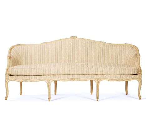 A CREAM, GREEN AND BLUE PAINTED SERPENTINE SOFA  FRENCH, LATE 19TH CENTURY, IN THE LOUIS XV STYLE   With Sibyl Colefax & John