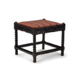 Y A CARVED EBONY STOOL, CEYLONESE, SECOND HALF 19TH CENTURY