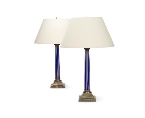 A PAIR OF BRASS MOUNTED GLASS LAMPS  19TH CENTURY AND LATER In the form of ionic capitals with blue and white glass reeding  