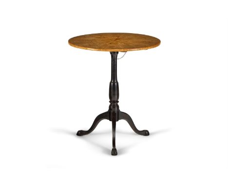 A BIRCHWOOD AND EBONISED TRIPOD TABLE SWEDISH, FIRST HALF 19TH CENTURY The circular tilt top radially veneered  74cm high, 66