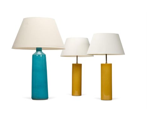 A PAIR OF YELLOW GLAZED CYLINDRICAL POTTERY LAMPS  MODERN 74cm high overallTogether with a turquoise glazed lamp of large siz