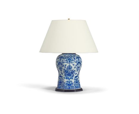 A DELFT BLUE AND WHITE FACETTED VASE DUTCH, EARLY 19TH CENTURY Mounted and wired as a lamp 66cm high overall 