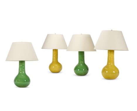FOUR GLAZED POTTERY LAMPS MODERN One pair green, the other yellow The yellow pair 75cm high overall, the green pair 70cm high