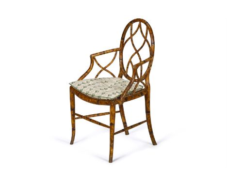 A FAUX BAMBOO PAINTED OPEN ARMCHAIR ENGLISH, 19TH CENTURY   With a Sibyl Colefax & John Fowler 'Bees Forest' upholstered squa