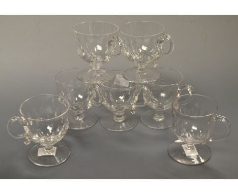 A set of six late 19th century clear glass custard cups; another similar (7)