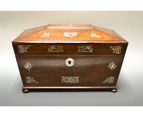 A Victorian rosewood tea caddy with mother of pearl inlay