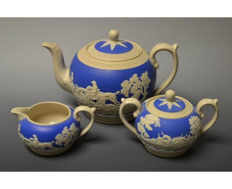 A Copeland Spode teapot, milk and sugar with applied relief moulded hunting scene 