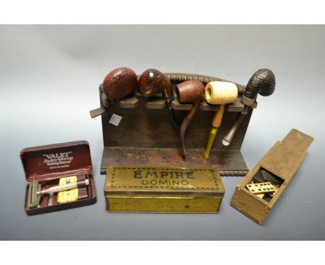 Gentleman's accessories - a pipe rack and contents, razor, dominoes, etc