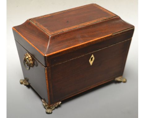 A William IV canted rectangular tea caddy, hinged inlaid top, two division lidded interior, cast pow feet, c.1830