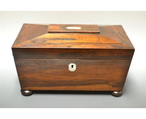 A 19th century rosewood sarcophagus shape tea caddy, part fitted, ring handles, mother -of-pearl escutcheon, bun feet, 30cm w