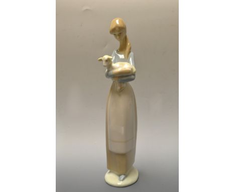 A large Lladro figure, young girl holding a lamb