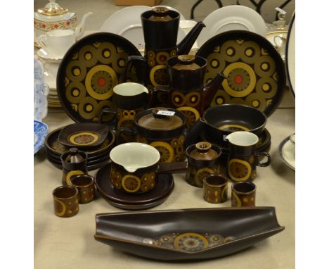 A Denby Arabesque pattern coffee pot, another, various plates, boat shaped fruit dish, preserve pot and cover, cups and sauce