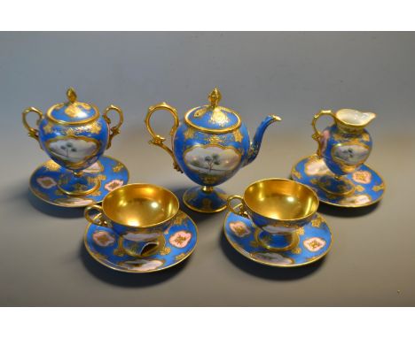 A Noritake cabinet tea service with tea pot, with milk,sugar, cups and saucers, turquoise and gilt ground, reserves painted w