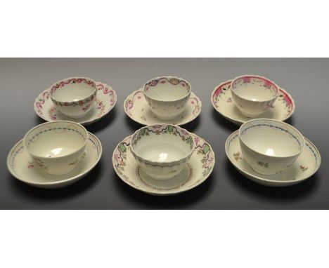 A pair of New Hall type tea bowl and saucer, decorated with stylised sprigs, undulating dotted line and blue husk border, c.1