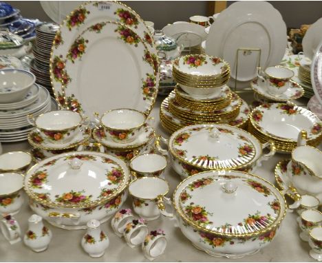 A Royal Albert Old Country Roses dinner service for six including two oval platters, three tureens and covers; gravy boat and