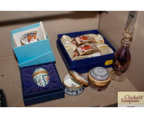 A pair of Royal Crown Derby porcelain napkin rings; various Halcyon Days enamel boxes etc.