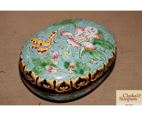 A Chinese blue enamel oval box and cover decorated insects and flowers 