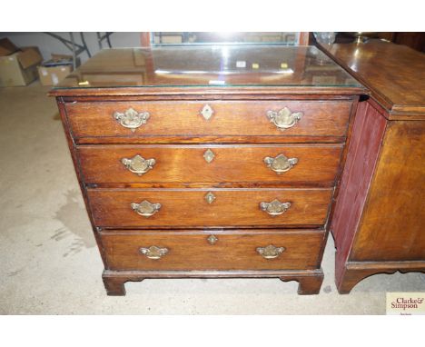 An 18th Century oak chest fitted four graduated drawers