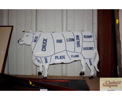An enamel cow sign 
