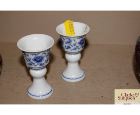 A pair of blue and white Chinese baluster stem cups with seal marks to the base