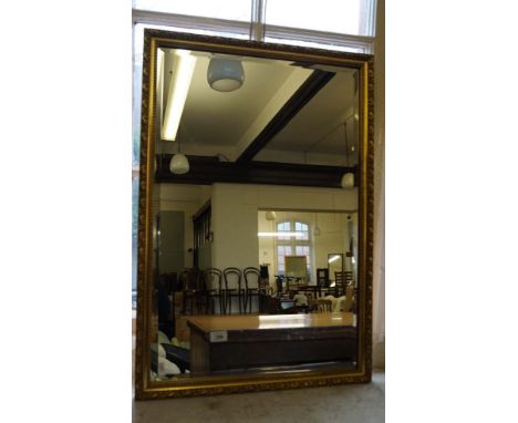 A Vintage gilt framed bevelled edged wall mirror.