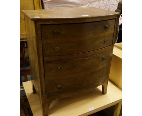 A Georgian mahogany bowfront commode chest of drawers. 
