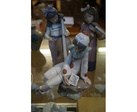 Three Nao figurines to include two girls and a clown.