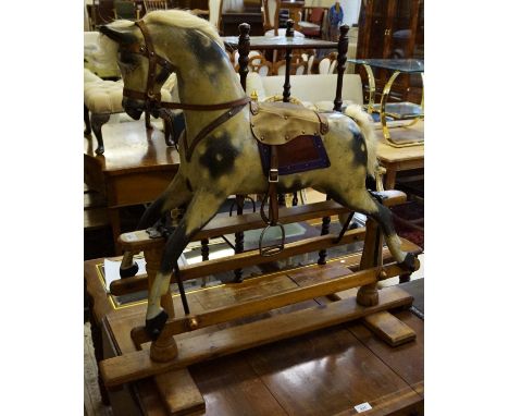 A good quality J R Smith, circa 1900 33 inch high very charming child's rocking horse of small proportions, having hand paint