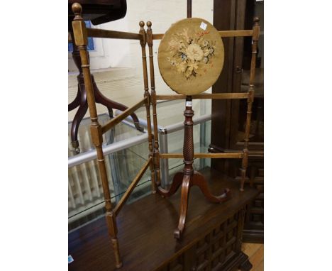 A Victorian mahogany wall screen having tapestry inset panel together with a folding clothes rail. 