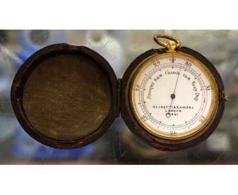 A good Negretti & Zambra pocket barometer with white enamel face, inside a gilt metal outer case, numbered 11421 and dated Oc