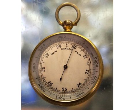 A gilt metal circular pocket barometer with silvered face, length 7cm

