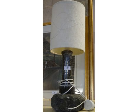 A Cornish serpentine table lamp in the form of a lighthouse.