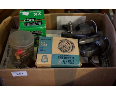 A mixed lot of assorted fishing items to include a light weight fly reel, further reels, etc.